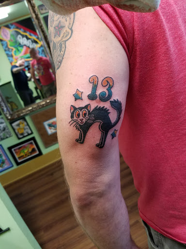 Explore name cover up tattoo ideas for men, creative tattoo ideas in Shreveport, available at Red Handed Tattoo