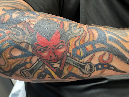 Explore mens cross tattoo ideas, creative tattoo ideas in Stuart, available at Tiger Shark Tattoo Studio