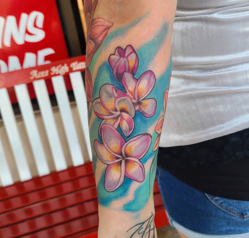Explore forearm rose tattoo ideas, creative tattoo ideas in Stuart, available at Tiger Shark Tattoo Studio