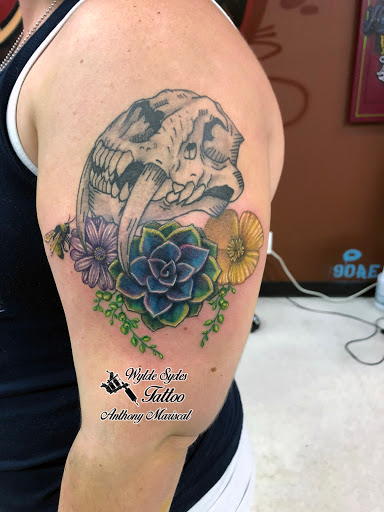 Find christmas tattoo ideas for your next unique tattoo in San Diego at Wylde Sydes Tattoo & Body Piercing