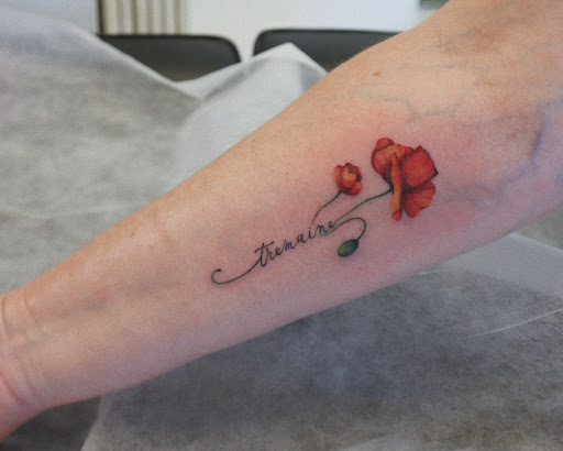 Explore fish tattoo ideas for females, creative tattoo ideas in Orange, available at Baron Art Tattoo