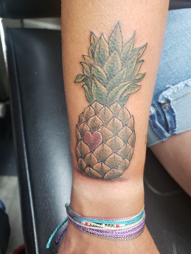 Explore flower tattoo ideas arm, creative tattoo ideas in Linn Creek, available at Hillard Skillard Tattoos, LLC.