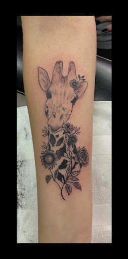 Explore front thigh tattoo ideas, creative tattoo ideas in Vermillion, available at IKTOMI-INK Tattoo Experience