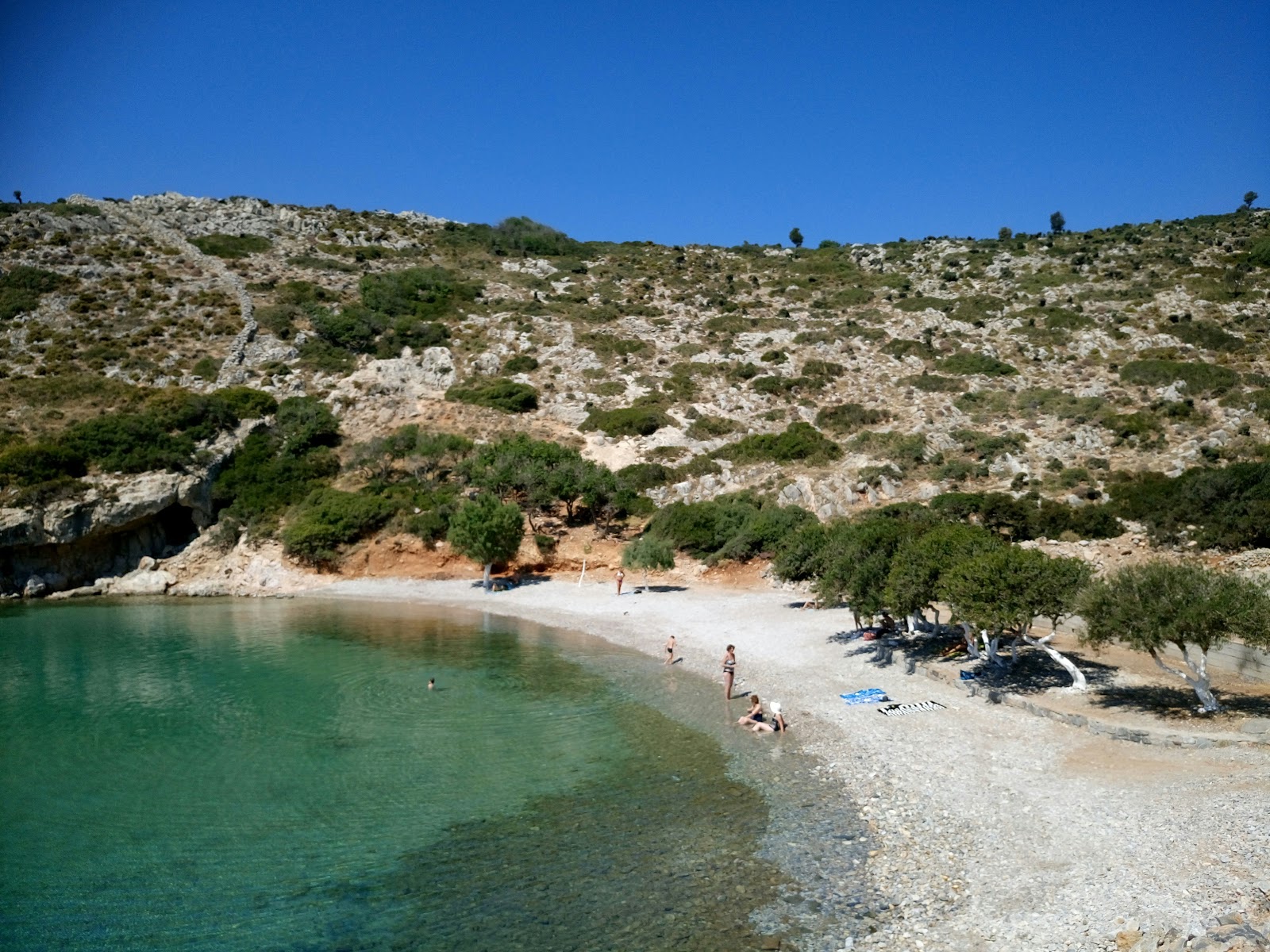 Foto van Spilia beach met turquoise puur water oppervlakte