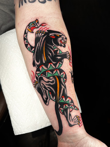 Explore black tattoo ideas for men, creative tattoo ideas in Johnson City, available at Gold Cross Tattoo Co.