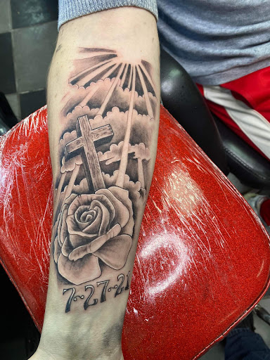 Explore cross tattoo ideas for men, creative tattoo ideas in Oak Grove, available at Purgatory Tattoos