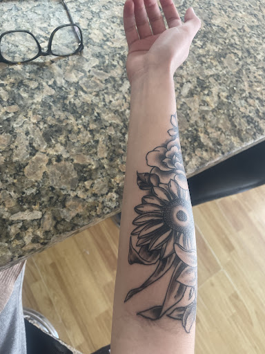 Explore orchid tattoo ideas, creative tattoo ideas in Apple Valley, available at Tried and True Tattoo Parlor