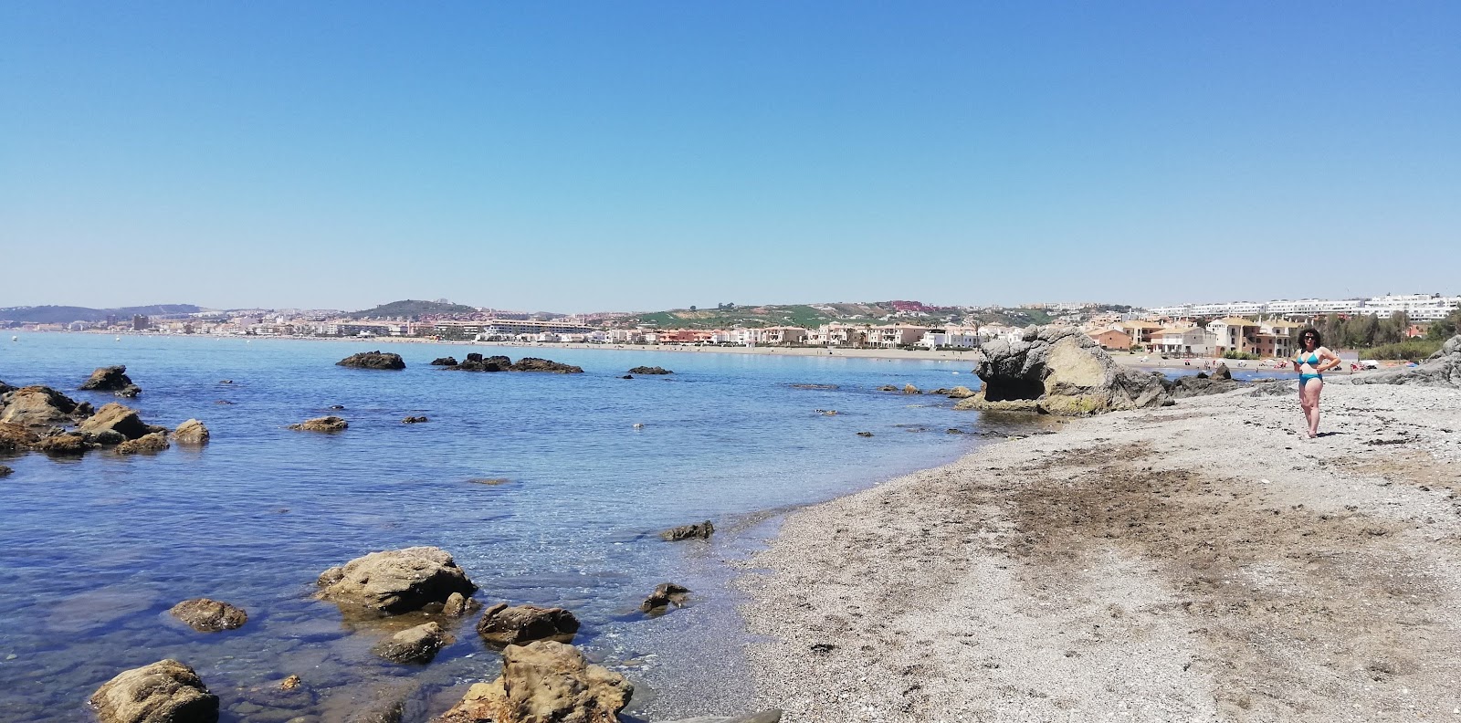Zdjęcie Playa Chica z powierzchnią szary piasek