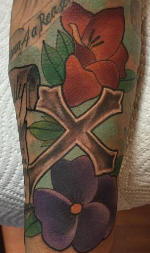 Explore black flower tattoo ideas, creative tattoo ideas in Modesto, available at Inkwell Tattoo