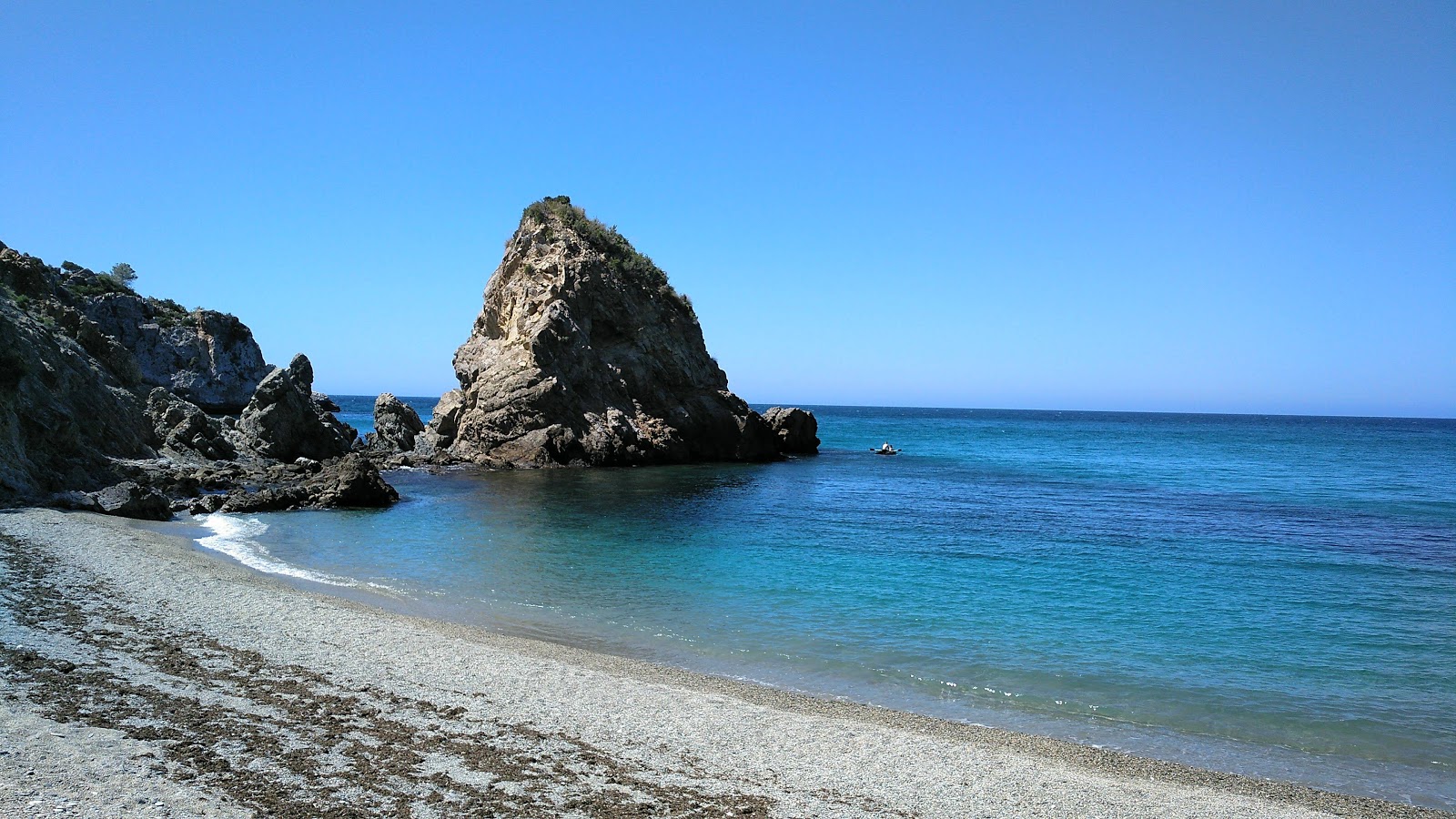 Photo of Cala del Canuelo with turquoise pure water surface