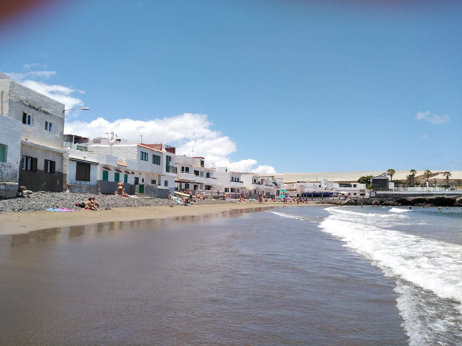 Foto di Playa de Ojos De Garza con una superficie del acqua verde-blu