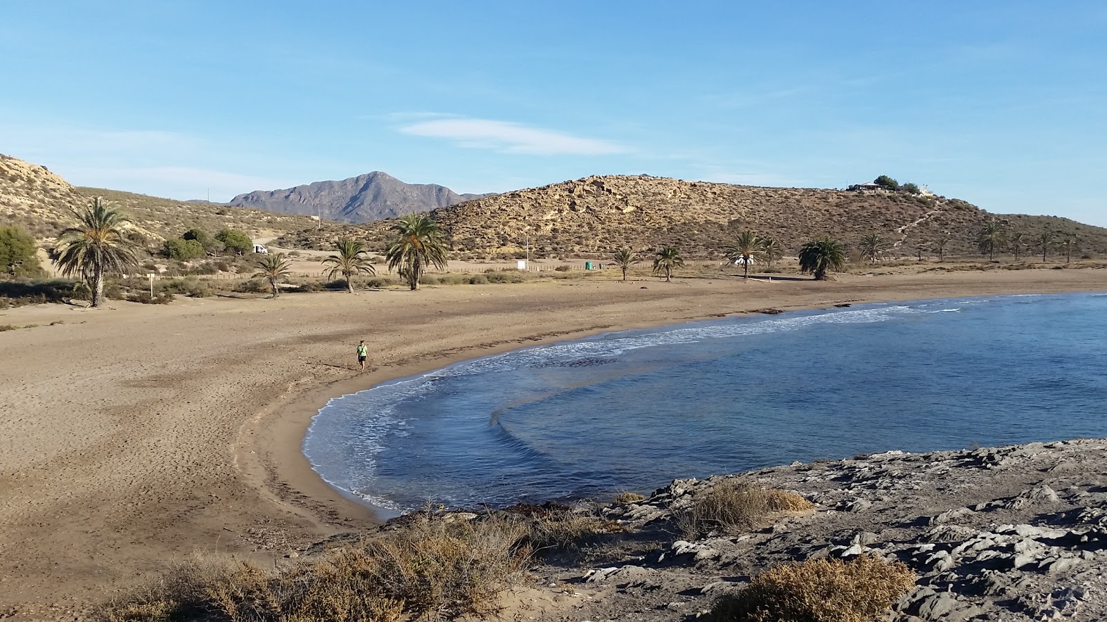 Foto de Playa Percheles con arena marrón superficie