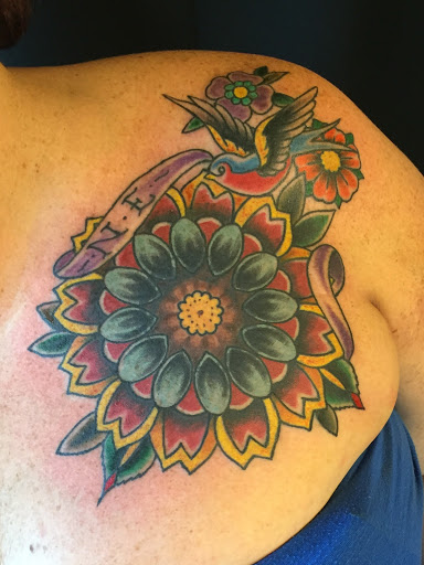 Explore sunflower and roses tattoo ideas, creative tattoo ideas in Laramie, available at Vintage Electric Tattoo