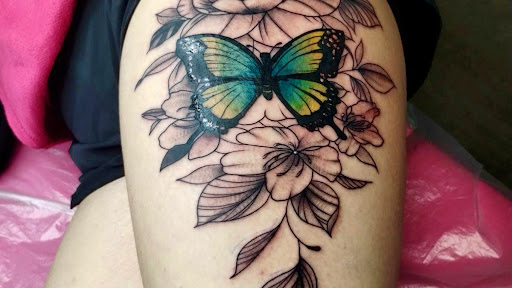 Explore simple hand tattoo ideas, creative tattoo ideas in Lake City, available at Crooked Spines Tattoo Studio