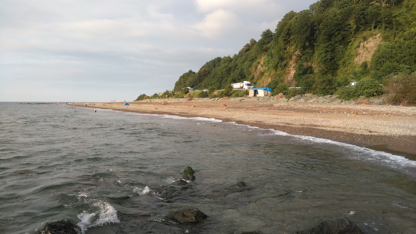Foto di Melyat Creek Beach con una superficie del sabbia beige e ciottoli