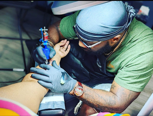 Explore cosmos flower tattoo ideas, creative tattoo ideas in Largo, available at Ink Godz Tattoo 2