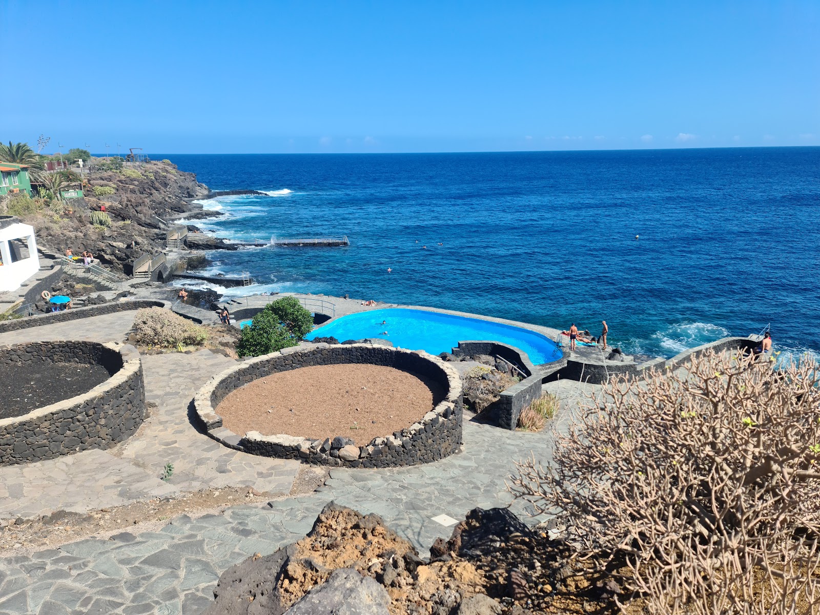 Photo of La Caleta Pools with concrete cover surface
