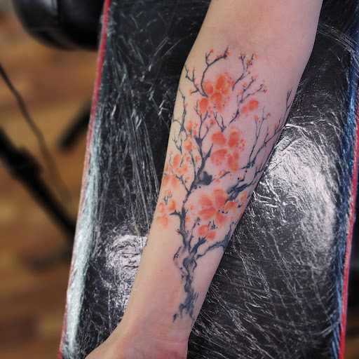 Explore bicep tattoo ideas men, creative tattoo ideas in Minocqua, available at Whisky Rose Tattoo Parlor