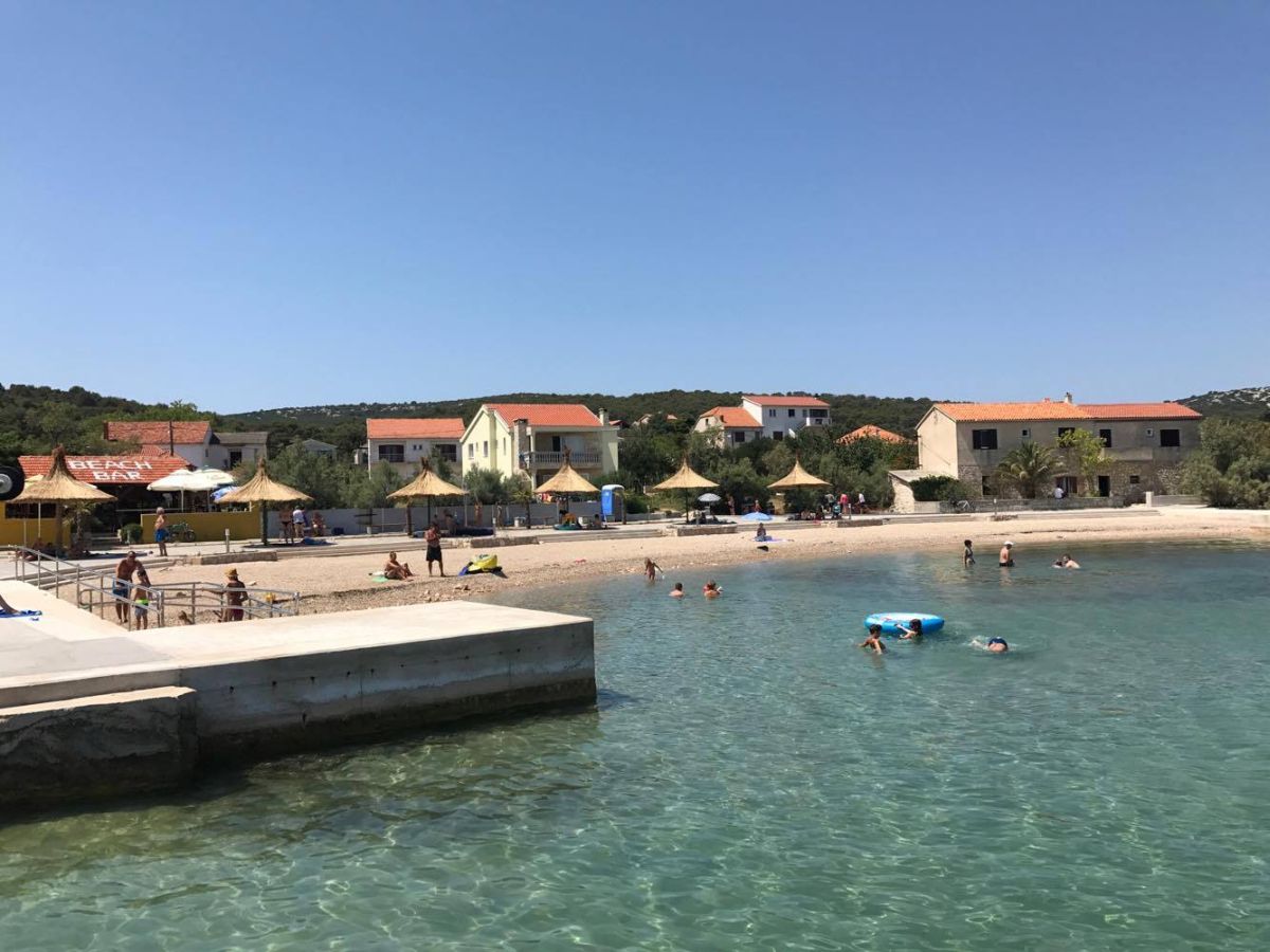 Foto von Tkon beach mit kleine bucht