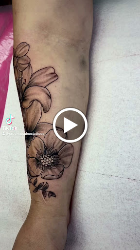 Explore koi fish tattoo sleeve ideas, creative tattoo ideas in Lake City, available at Crooked Spines Tattoo Studio