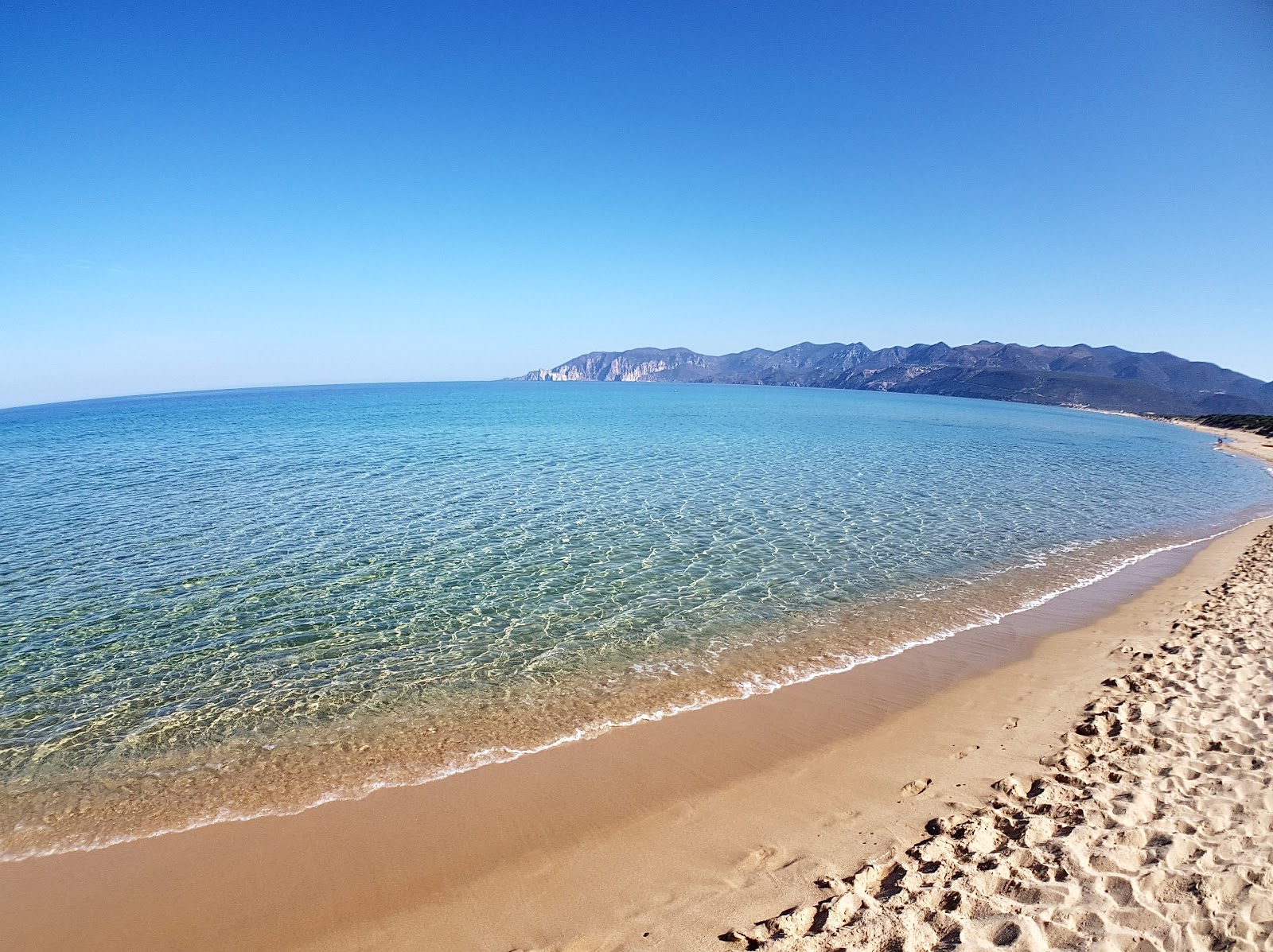 Foto av Stranden Porto Paglia med turkos rent vatten yta