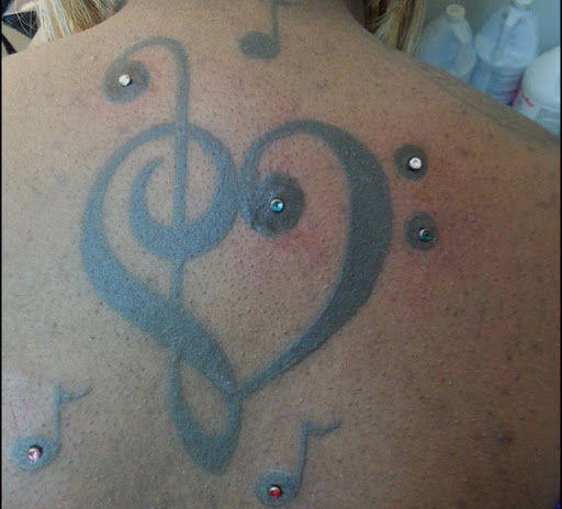 Explore lower half sleeve tattoo ideas for females, creative tattoo ideas in Milwaukee, available at Piercings Plus