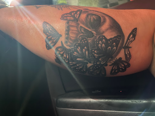 Explore family birth flower tattoo ideas, creative tattoo ideas in Ocoee, available at Slaughterized Ink Tattoo and Piercing Studio