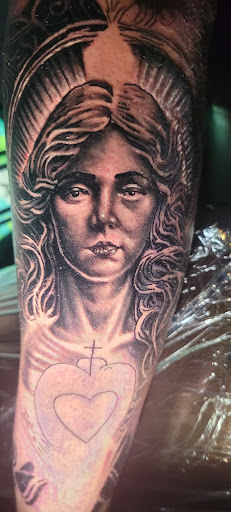 Explore tattoo ideas brazo, creative tattoo ideas in Angola, available at Hoodlum Ink