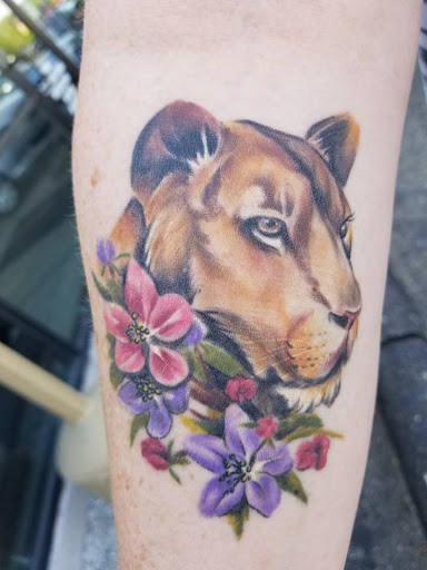 Explore harmonica tattoo ideas, creative tattoo ideas in East Lansing, available at Splash of Color Tattoo & Piercing Studio