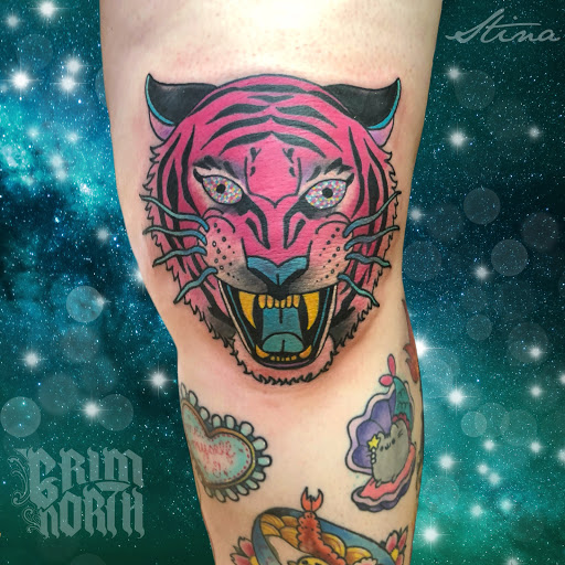 Explore shark tooth tattoo ideas, creative tattoo ideas in Portsmouth, available at Grim North Tattoo and Piercing