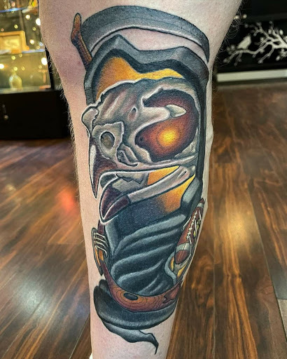 Explore football tattoo ideas, creative tattoo ideas in Dubuque, available at The Crows Nest
