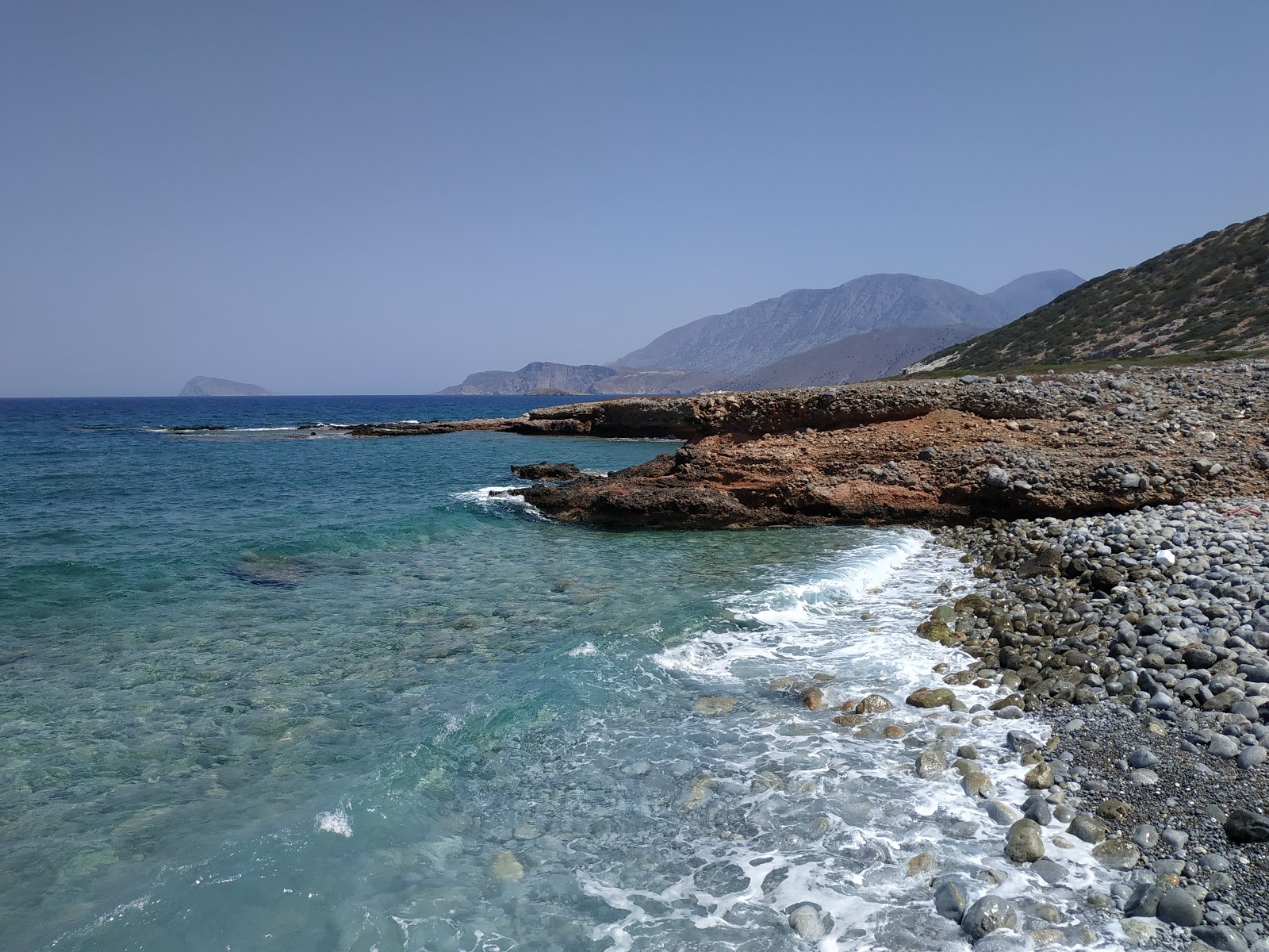 Photo of Kamini beach with blue pure water surface