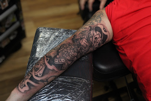 Explore family tattoo ideas for guys on arm, creative tattoo ideas in Homosassa, available at Citrus Tattoos