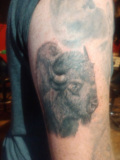 Explore mom dad tattoo ideas, creative tattoo ideas in Lander, available at Blackblood Tattoo and Piercing