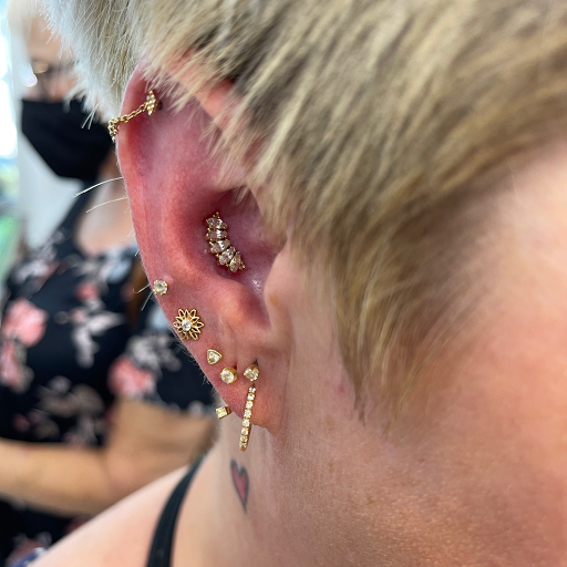 Explore statue tattoo ideas, creative tattoo ideas in Medford, available at Agave in Bloom Piercing & Fine Jewelry