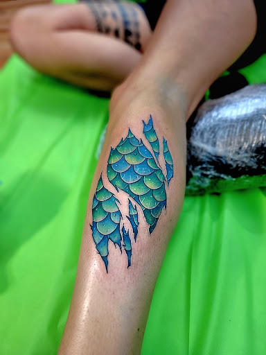 Explore venom tattoo ideas, creative tattoo ideas in Benton, available at Spectrum Tattoo