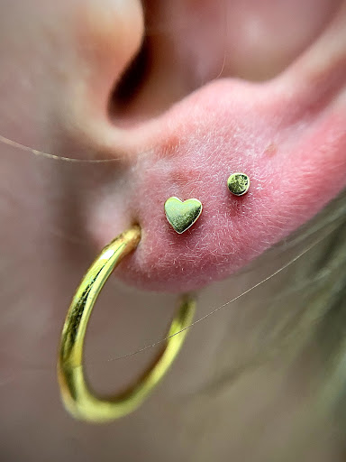 Explore wolf tattoo ideas for guys, creative tattoo ideas in Orange, available at Symbiosis Body Piercing