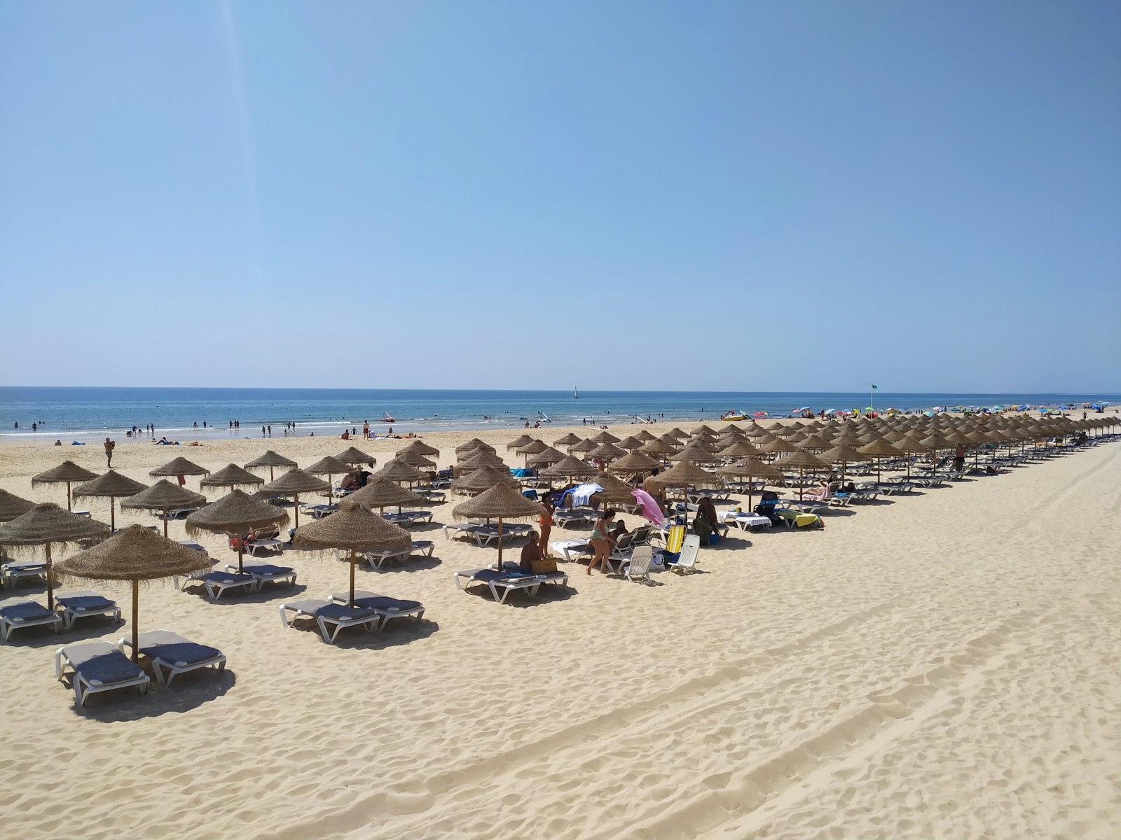 Foto van Verde Strand met helder fijn zand oppervlakte