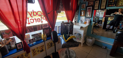 Find under boob tattoo ideas for your next unique tattoo in Englewood at The Original Big Daddy Tattoo & Body Piercing est.1997 est.1997