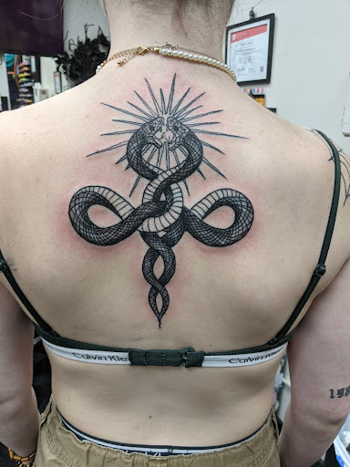 Explore male leg tattoo ideas, creative tattoo ideas in Slippery Rock, available at Dinky Dachshund Tattoo Parlor