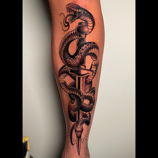 Explore lower back tattoo ideas for females, creative tattoo ideas in Fayetteville, available at Sacred Raven Tattoo Shop