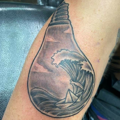 Explore arrow tattoo ideas for men, creative tattoo ideas in Mckinney, available at Borrowed Time Fine Art Gallery Tattoo Shop