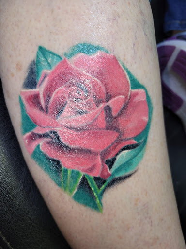 Explore thigh tattoo ideas, creative tattoo ideas in Angola, available at Hoodlum Ink