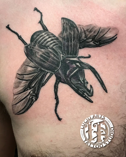 Explore guns and roses tattoo ideas, creative tattoo ideas in Tewksbury, available at Lucid Arts Tattoo Studio