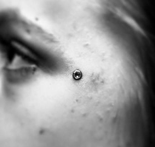 Explore small alien tattoo ideas, creative tattoo ideas in Houston, available at Biolab Fine Jewelry and Body Piercing Studio