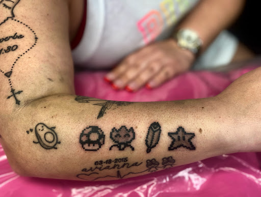 Explore spark plug tattoo ideas, creative tattoo ideas in Lake City, available at Crooked Spines Tattoo Studio
