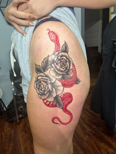 Explore torn skin tattoo ideas, creative tattoo ideas in Hudson, available at Twisted Canvas Tattoo and Art Studio