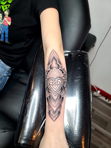 Explore cat paw print tattoo ideas, creative tattoo ideas in Clarkston, available at Rogue Tattoo