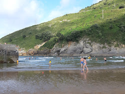 Foto von Playa de Miono und die siedlung