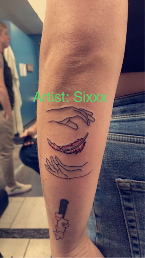 Explore marriage ring tattoo ideas, creative tattoo ideas in Foley, available at Symbolic Ink Tattoo Studio